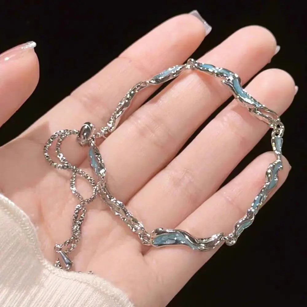 Model wearing layered seasonal bracelets, highlighting lightweight fit and elegant design.