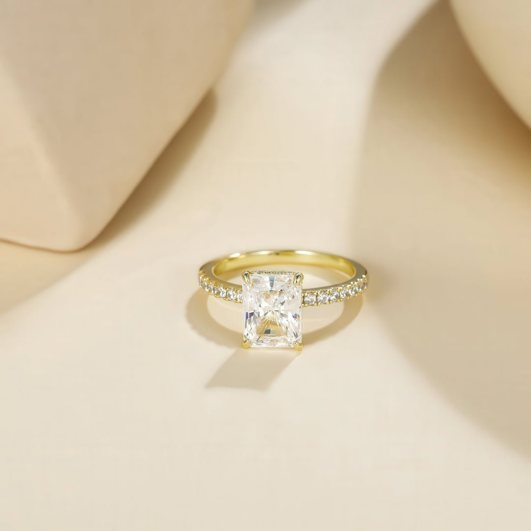 Flat lay of sterling silver cubic zirconia ring with fade-proof finish and smooth band.